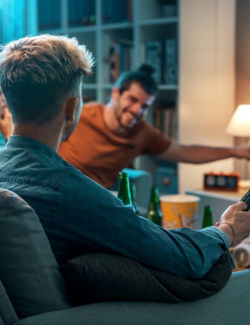 Friends watching movies together at home Friends watching movies together at home